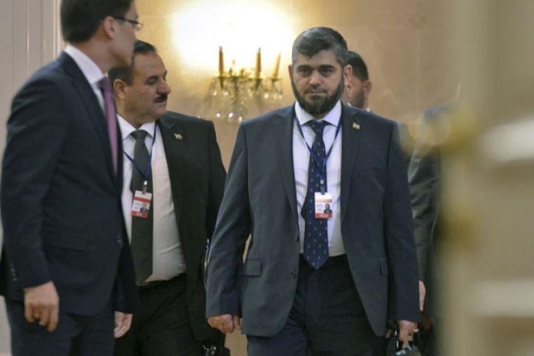 epa05797203 Mohammed Alloush (C) of the Jaish al Islam faction, chief negotiator for the Syrian rebel side, attends the second round of talks on the Syrian conflict settlement in Astana, Kazakhstan, 16 February 2017. A fresh round of talks on the Syria conflict got underway and was backed by Russia, Turkey, and Iran and endorsed by the UN. EPA/TURAR KAZANGAPOV