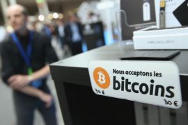 HANOVER, GERMANY - MARCH 16: A sign in French that reads: 'We accept bitcoins' hangs at a display of the LedgerWallet Nano USB stick that enables security-protected transactions with bitcoins at the 2015 CeBIT technology trade fair on March 16, 2015 in Hanover, Germany. China is this year's CeBIT partner. CeBIT is the world's largest tech fair and will be open from March 16 through March 20. (Photo by Sean Gallup/Getty Images)
