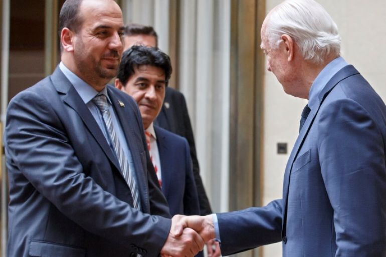 Syria's main opposition High Negotiations Committee (HNC) leader Nasr al-Hariri shakes hands with UN Special Envoy of the Secretary-General for Syria Staffan de Mistura, right, prior a round of negotiation, during the Intra Syria talks, at the European headquarters of the United Nations in Geneva, Switzerland, Tuesday, May 16, 2017. REUTERS/Salvatore Di Nolfi/Pool