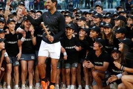 Tennis - ATP 1000 Masters - Madrid Open - Men's Singles Final - Dominic Thiem of Austria v Rafael Nadal of Spain - Madrid, Spain - 14/5/17 - Nadal reacts after posing with ball boys and girls after his match. REUTERS/Susana Vera