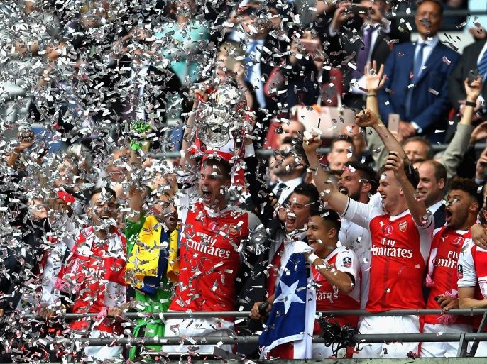 LONDON, ENGLAND - MAY 27: Laurent Koscielny of Arsenal lifts The FA Cup after The Emirates FA Cup Final between Arsenal and Chelsea at Wembley Stadium on May 27, 2017 in London, England. (Photo by Laurence Griffiths/Getty Images)