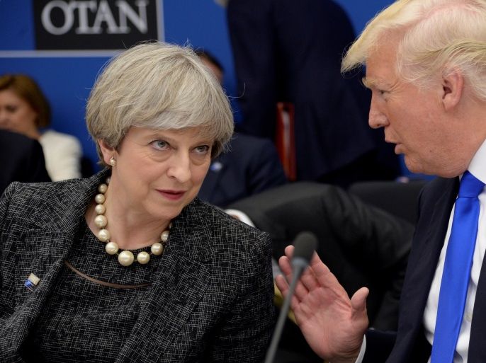 U.S. President Donald Trump (R) speaks to Britain's Prime Minister Theresa May during in a working dinner meeting at the NATO headquarters during a NATO summit of heads of state and government in Brussels, Belgium, May 25, 2017. REUTERS/Thierry Charlier/Pool