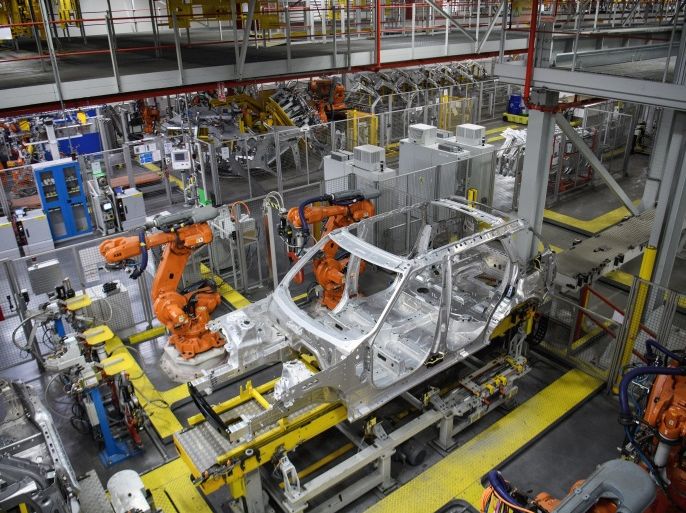 SOLIHULL, ENGLAND - MARCH 06: Robotic systems work on the chassis of a car during an automated stage of production at the Jaguar Land Rover factory on March 1, 2017 in Solihull, England. The company has pledged it's 'heart and soul' to production in the UK after producing the new 'Velar' model for global sale, at their Solihull factory. (Photo by Leon Neal/Getty Images)