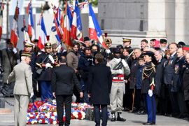PARIS, FRANCE - MAY 08: French president-elect Emmanuel Macron and outgoing French President Francois Hollande pat their respects as they attend a ceremony to mark the Western allies' World War Two victory in Europe at the Arc De Triumphe on May 8, 2017 in Paris, France. The ceremony marks the 72nd anniversary of the victory over Nazi Germany in 1945. (Photo by Jeff J Mitchell/Getty Images)