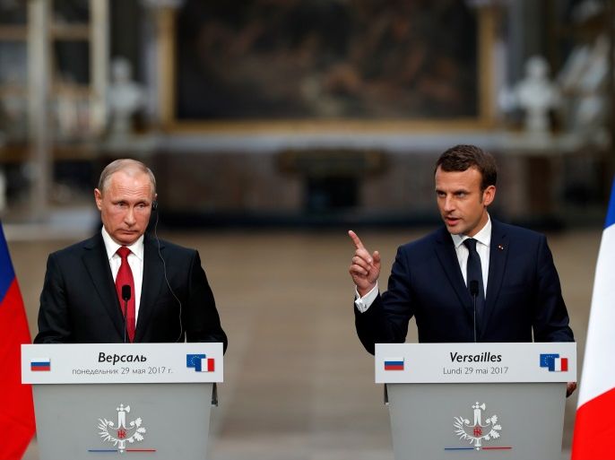 French President Emmanuel Macron (R) and Russian President Vladimir Putin (L) give a joint press conference at the Chateau de Versailles before the opening of an exhibition marking 300 years of diplomatic ties between the two countries in Versailles, France, May 29, 2017. REUTERS/Philippe Wojazer