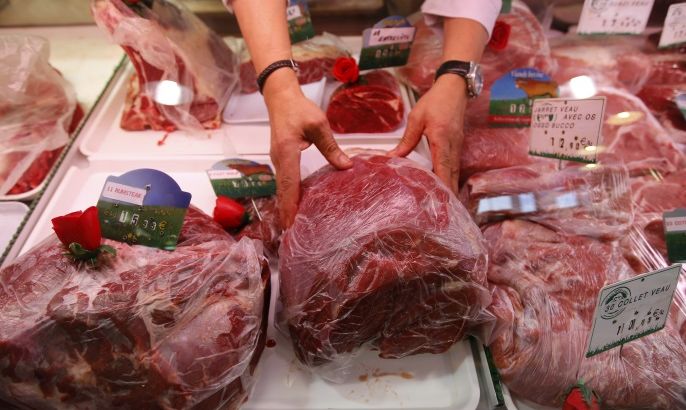 A butcher arranges pieces of meat at his shop in Marseille, France, October 27, 2015. Eating processed meats like hot dogs, sausages and bacon can cause colorectal cancer in humans, and red meat is also a likely cause of the disease, World Health Organization (WHO) experts said. The review by WHO's International Agency for Research on Cancer (IARC), released on Monday, said additionally that there was some link between the consumption of red meat and pancreatic cancer