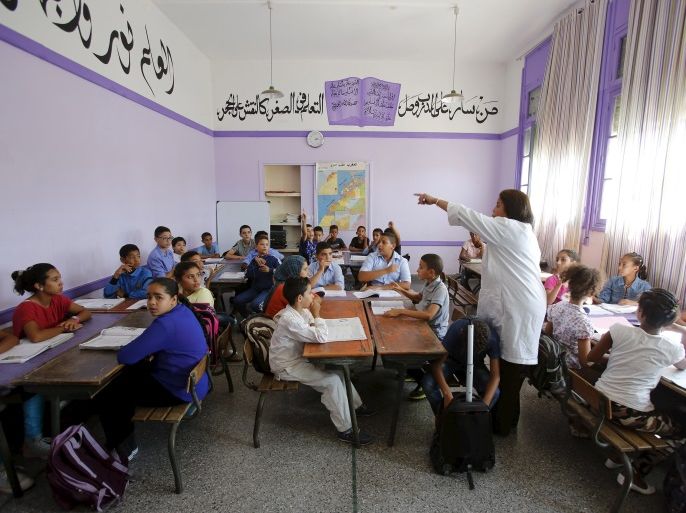 Schoolchildren listen to a teacher as they study during a class in the Oudaya primary school in Rabat, September 15, 2015, at the start of the new school year in Morocco. Nearly three years after Taliban gunmen shot Pakistani schoolgirl Malala Yousafzai, the teenage activist last week urged world leaders gathered in New York to help millions more children go to school. World Teachers' Day falls on 5 October, a Unesco initiative highlighting the work of educators struggling to teach children amid intimidation in Pakistan, conflict in Syria or poverty in Vietnam. Even so, there have been some improvements: the number of children not attending primary school has plummeted to an estimated 57 million worldwide in 2015, the U.N. says, down from 100 million 15 years ago. Reuters photographers have documented learning around the world, from well-resourced schools to pupils crammed into corridors in the Philippines, on boats in Brazil or in crowded classrooms in Burundi. REUTERS/Youssef BoudlalPICTURE 40 OF 47 FOR WIDER IMAGE STORY