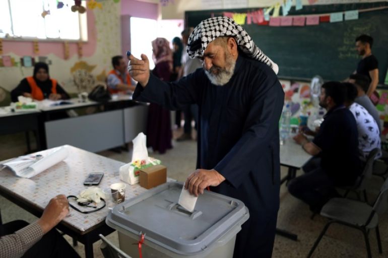 A Palestinian man casts his ballot at a polling station during municipal elections in the West Bank village of Yatta, near Hebron May 13, 2017. REUTERS/Ammar Awad