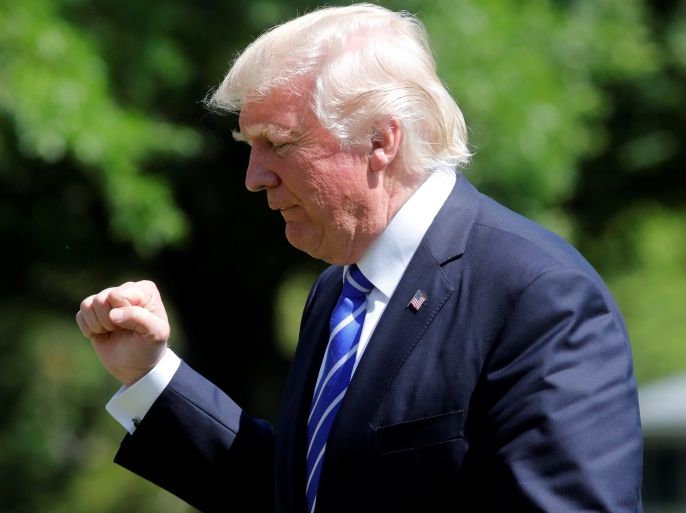 U.S. President Donald Trump gestures as he walks on the South Lawn of the White House upon his return to Washington, U.S., May 17, 2017. REUTERS/Yuri Gripas
