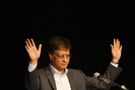 HAIFA, ISRAEL - JULY 15: Palestinian poet and journalist Mahmoud Darwish reads during his poetry show July 15, 2007 in Haifa, Israel. Darwish, seen as a symbol of Palestinian nationalism, made his first appearance in Israel on Sunday since his self-imposed exile from Israel, where he lived until 1971. (Photo by Gil Cohen Magen-Pool/Getty Images)