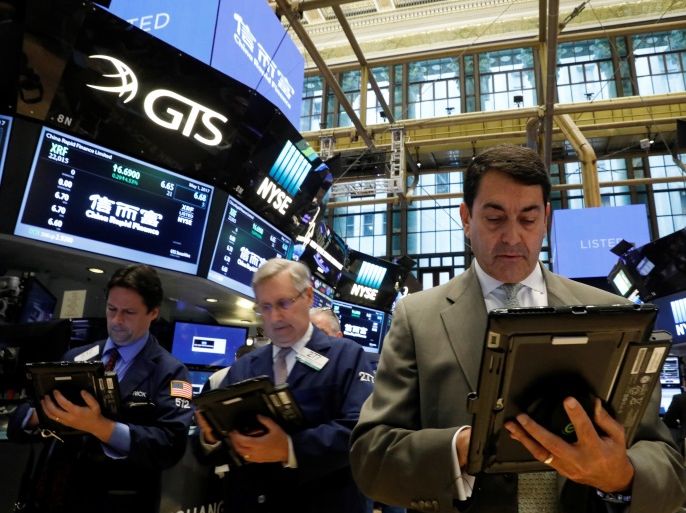 Traders work on the floor of the New York Stock Exchange (NYSE) in New York, U.S., May 1, 2017. REUTERS/Brendan McDermid