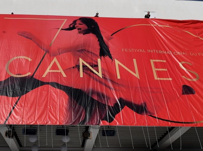 CANNES, FRANCE - MAY 15: Workers install the official Poster of the 70th Cannes Film Festival at Palais des Festivals on May 15, 2017 in Cannes, France. (Photo by Pascal Le Segretain/Getty Images)