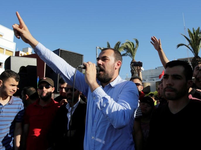 Moroccan activist and the leader of the protest movement Nasser Zefzafi gives a speech during a demonstration in the northern town of Al-Hoceima, seven months after a fishmonger was crushed to death inside a garbage truck as he tried to retrieve fish confiscated by the police, in Al-Hoceima, Morocco May 18, 2017. REUTERS/Youssef Boudlal