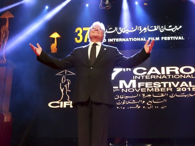 Egyptian actor Hussein Fahmy gestures as he stands on stage to receive an honorary lifetime achievement award during the opening ceremony of the 37th Cairo International Film Festival (CIFF), in Cairo, Egypt, November 11, 2015. REUTERS/Mohamed Abd El Ghany