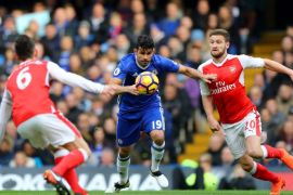 LONDON, ENGLAND - FEBRUARY 04: Diego Costa of Chelsea battles for the ball with Shkodran Mustafi of Arsenal during the Premier League match between Chelsea and Arsenal at Stamford Bridge on February 4, 2017 in London, England. (Photo by Clive Rose/Getty Images)