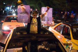 A girl holds posters of Iranian President Hassan Rouhani during a campaign rally in Tehran, Iran, May 17, 2017. Picture taken May 17, 2017. TIMA via REUTERS ATTENTION EDITORS - THIS IMAGE WAS PROVIDED BY A THIRD PARTY. FOR EDITORIAL USE ONLY.