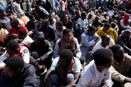 Illegal African migrants sit during a visit by U.N. Special Representative and Head of the United Nations Support Mission in Libya Martin Kobler and International Organization for Migration Director General William Lacy Swing at a detention camp in Tripoli, Libya, March 22, 2017. REUTERS/Ismail Zitouny