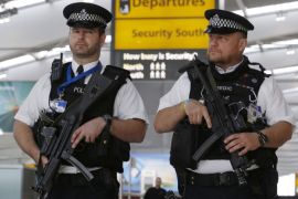 Armed police patrol at Terminal 5, Heathrow Airport in London, Britain March 22, 2016. REUTERS/Luke MacGregor