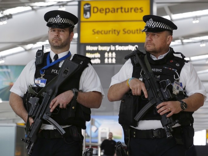 Armed police patrol at Terminal 5, Heathrow Airport in London, Britain March 22, 2016. REUTERS/Luke MacGregor