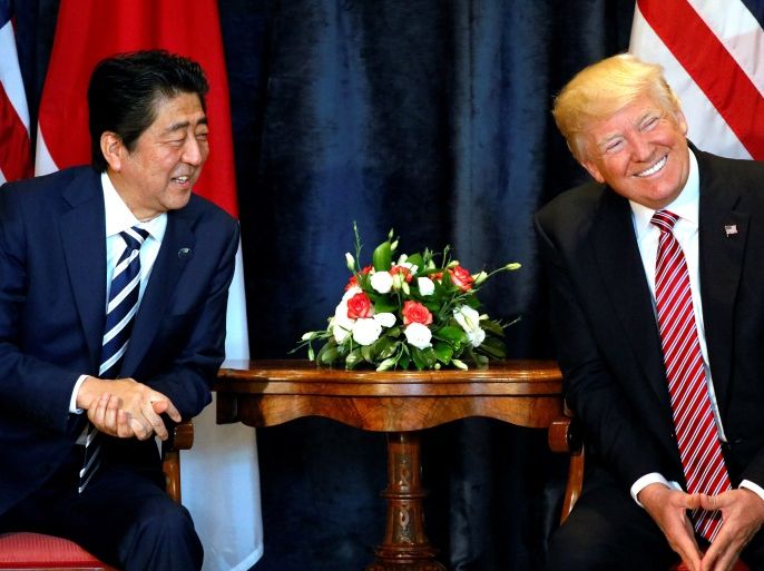 U.S. President Donald Trump (R) and Japan's Prime Minister Shinzo Abe smile during a bilateral meeting at the G7 summit in Taormina, Sicily, Italy, May 26, 2017. REUTERS/Jonathan Ernst