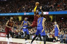 Dec 25, 2016; Cleveland, OH, USA; Cleveland Cavaliers forward LeBron James (23) takes a shot against Golden State Warriors center JaVale McGee (1) at Quicken Loans Arena. Cleveland defeats Golden State 109-108. Mandatory Credit: Brian Spurlock-USA TODAY Sports