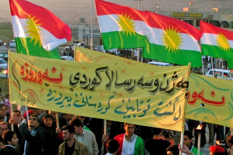 Iraqi Kurds carry Kurdish flags as they march during New Year celebrations near the northern Iraqi town of Arbil March 20, 2006. Kurds around the world celebrate the arrival of spring with the traditional Nawroz celebration. Picture taken March 20, 2006. REUTERS/Azad Lashkari