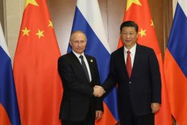 BEIJING, CHINA - MAY 13: Russian President Vladimir Putin (L) shakes hands with Chinese President Xi Jinping ahead a bilateral meeting at Diaoyutai State Guesthouse in Beijing, China, 14 May 2017. The Belt and Road Forum focuses on the One Belt, One Road (OBOR) trade initiative. (Photo by Wu Hong-Pool/Getty Images)