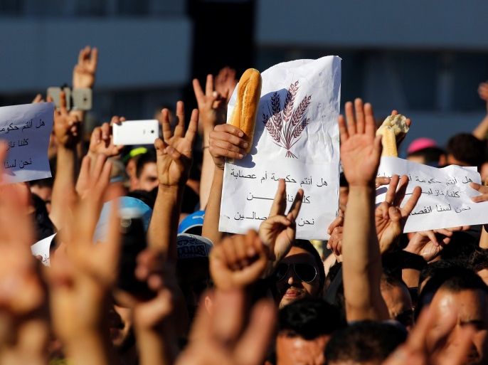 Thousands of Moroccans shout slogans during a demonstration in the northern town of Al-Hoceima, seven months after a fishmonger was crushed to death inside a garbage truck as he tried to retrieve fish confiscated by the police, in Al-Hoceima, Morocco May 18, 2017. REUTERS/Youssef Boudlal