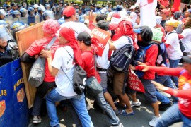 Activists force their way through shields of the anti-riot police to get near the U.S. Embassy as part of the Labor Day protest in metro Manila, Philippines May 1, 2017. REUTERS/Romeo Ranoco
