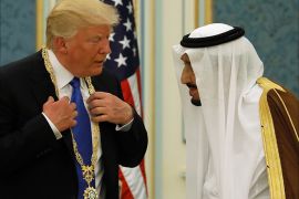 Saudi Arabia's King Salman bin Abdulaziz Al Saud (R) presents U.S. President Donald Trump with the Collar of Abdulaziz Al Saud Medal at the Royal Court in Riyadh, Saudi Arabia May 20, 2017. REUTERS/Jonathan Ernst