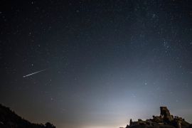 CORFE CASTLE, UNITED KINGDOM - AUGUST 12: A Perseid Meteor flashes across the night sky above Corfe Castle on August 12, 2016 in Corfe Castle, United Kingdom. The Perseids meteor shower occurs every year when the Earth passes through the cloud of debris left by Comet Swift-Tuttle, and appear to radiate from the constellation Perseus in the north eastern sky. (Photo by Dan Kitwood/Getty Images)
