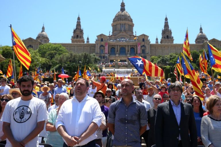 Manchester City's manager Pep Guardiola and Catalan Regional President Carles Puigdemont take part in a pro-independence rally in Barcelona, Spain June 11, 2017. REUTERS/Albert Gea
