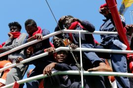 FILE PHOTO: Migrants waits to disembark from the Vos Hestia ship as they arrives in the Crotone harbour, Italy, after being rescued by