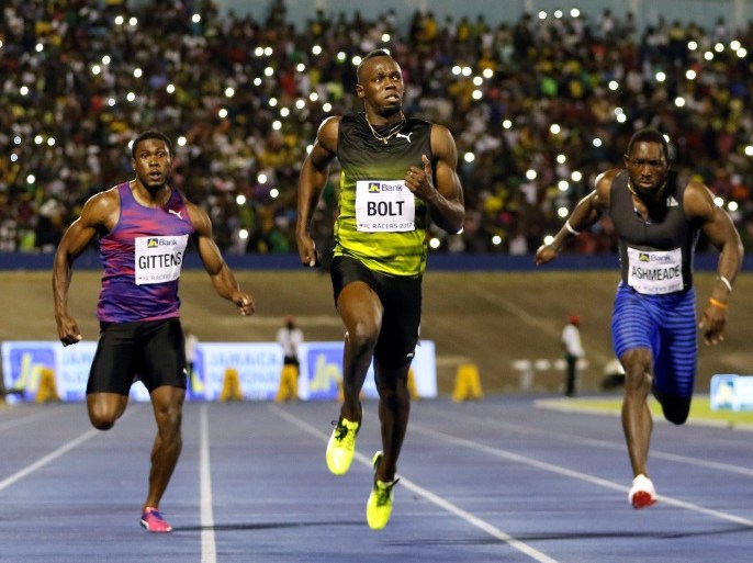 Jamaica's Olympic champion Usain Bolt (C) crosses the finish line as he wins his final 100 meters sprint at the 2nd Racers Grand Prix at the National Stadium in Kingston, Jamaica June 10, 2017. REUTERS/Gilbert Bellamy