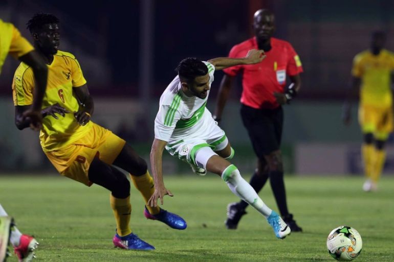epa06023698 Algeria's Riyad Mahrez (R) fights for the ball with Togo's Gbegnon Simon (L) during the African Cup of Nations (AFCON) 2019 qualifier soccer match between Algeria and Togo at Mustapha Tchaker Stadium in Blida, south of Algiers, Algeria, 11 June 2017. EPA/STRINGER