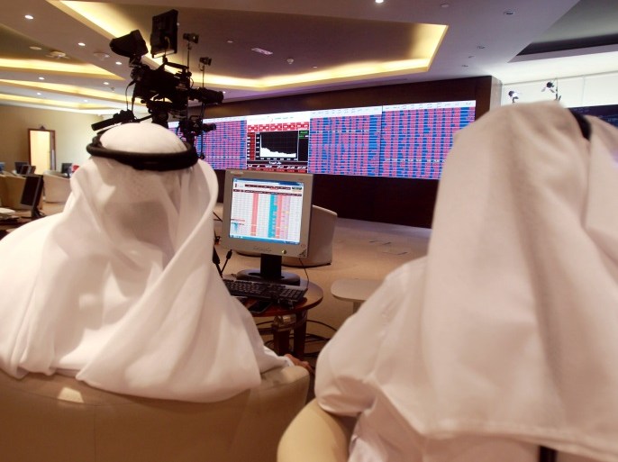 Traders monitor screens displaying stock information at Qatar Stock Exchange in Doha, Qatar June 5, 2017. REUTERS/Stringer TPX IMAGES OF THE DAY