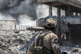 MOSUL, IRAQ - JUNE 17: An Iraqi Army soldier looks at an Iraqi forces airstrike which targeted an Islamic State sniper position June 17, 2017 in al-Shifa, the last district of west Mosul under Islamic State control. IS snipers, as well as car and suicide bomb attacks continue to hinder the Iraqi forces efforts to retake the final district. A series of airstrikes by Iraqi helicopter gunships attempted to hit multiple Islamic State sniper positions in al-Shifa today. (Mar