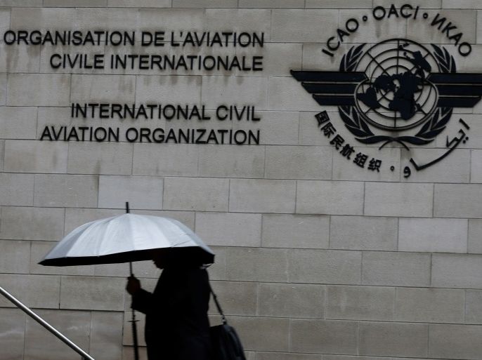 A pedestrian walks past the International Civil Aviation Organization (ICAO) headquarters building in Montreal, Quebec, Canada June 16, 2017. REUTERS/Christinne Muschi