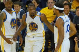 Jun 1, 2017; Oakland, CA, USA; Golden State Warriors forward Kevin Durant (35) celebrates with forward Andre Iguodala (9) and forward James Michael McAdoo (20) against the Cleveland Cavaliers in the first half of the NBA Finals at Oracle Arena. Mandatory Credit: Kelley L Cox-USA TODAY Sports