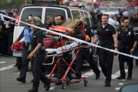 epa06058783 Medics leave the building after a shooter opened fire, killing at least one doctor and shooting six others before committing suicide at the Bronx-Lebanon Hospital Center in the Bronx, New York, USA, 30 June 2017. EPA/Kevin Hagen