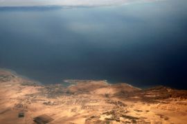 An aerial view of the coast of the Red Sea and the two islands of Tiran and Sanafir is pictured through the window of an airplane near Sharm el-Sheikh, Egypt November 1, 2016. Picture taken November 1, 2016. REUTERS/Amr Abdallah Dalsh