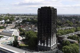 LONDON, ENGLAND - JUNE 16: The remains of Grenfell Tower are seen from a neighbouring tower block on June 16, 2017 in London, England. 30 people have been confirmed dead and dozens still missing after the 24 storey residential Grenfell Tower block in Latimer Road was engulfed in flames in the early hours of June 14. Emergency services will spend a third day searching through the building for bodies. Police have said that some victims may never be identified. (Photo by Carl Court/Getty Images)