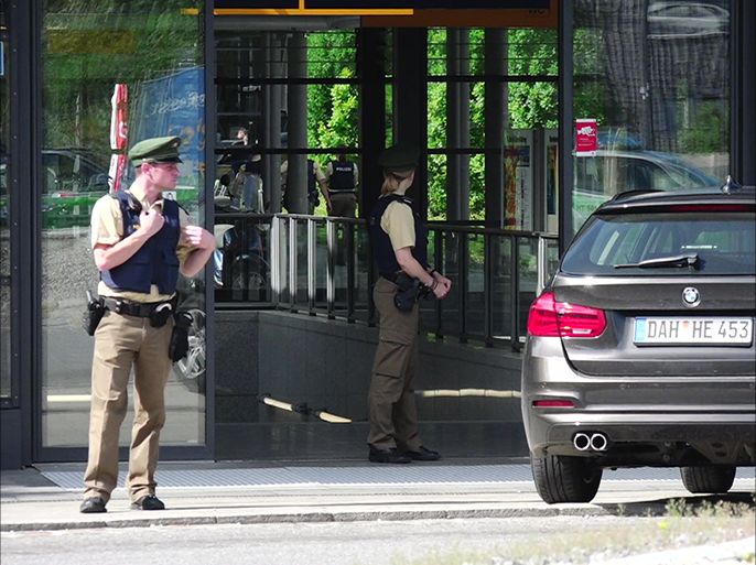 epa06025515 Armed German policemen secure the scene of a shooting at the Unterfoehring subway station in Munich, Germany 13 June 2017. According to reports, during a morning police check at the station a suspect took a police officer's pistol and then shot her, also injuring others at the scene. According to police information, it is probably not a terrorist attack. EPA/MARC MUELLER