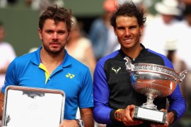 PARIS, FRANCE - JUNE 11: Winner, Rafael Nadal of Spain (R) and Runner Up Stan Wawrinka of Switzerland (L) pose with their trophies following the mens singles final on day fifteen of the 2017 French Open at Roland Garros on June 11, 2017 in Paris, France. (Photo by Clive Brunskill/Getty Images)