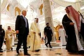 U.S. President Donald Trump (center L) walks with Saudi Arabia's King Salman bin Abdulaziz Al Saud (center R) to deliver remarks to the Arab Islamic American Summit in Riyadh, Saudi Arabia May 21, 2017. REUTERS/Jonathan Ernst