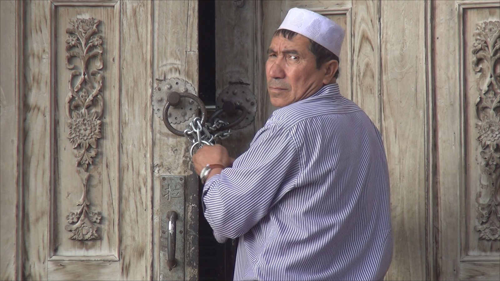 ‪مواطن من قومية الإيغور المسلمة في إقليم شينغيانغ‬ (الجزيرة)