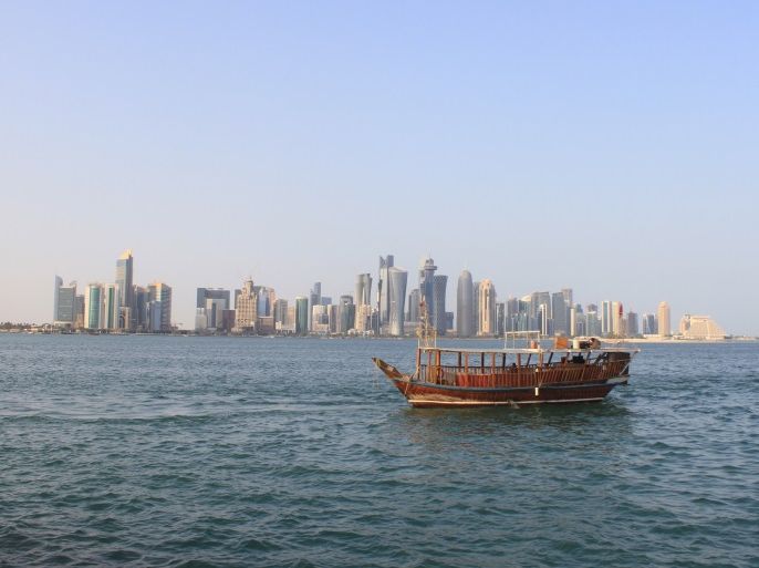 People travel in a traditional boat at Doha Corniche, Qatar, October 31, 2015. REUTERS/Naseem Zeitoon