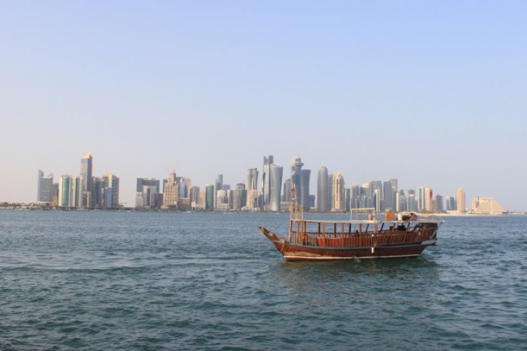 People travel in a traditional boat at Doha Corniche, Qatar, October 31, 2015. REUTERS/Naseem Zeitoon