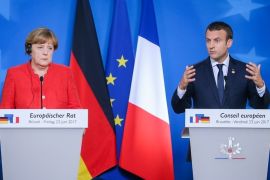 epa06045721 German Chancellor Angela Merkel (L) and French President Emmanuel Macron (R) hold a joint press conference at the end of the European Council in Brussels, Belgium, 23 June 2017. European heads of states and governments gathered for a two-days European Council meeting on 22 and 23 June mainly focussed 'on the ongoing efforts to strengthen the European Union and protect its citizens through the work on counterterrorism, security and defence, external borders,