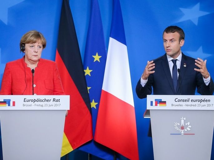 epa06045721 German Chancellor Angela Merkel (L) and French President Emmanuel Macron (R) hold a joint press conference at the end of the European Council in Brussels, Belgium, 23 June 2017. European heads of states and governments gathered for a two-days European Council meeting on 22 and 23 June mainly focussed 'on the ongoing efforts to strengthen the European Union and protect its citizens through the work on counterterrorism, security and defence, external borders,
